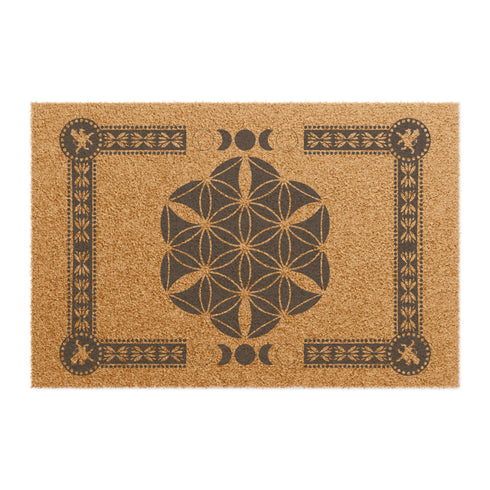 Coir doormat featuring Flower of Life symbol surrounded by lunar phases and protective sigils, in natural tan with black designs.